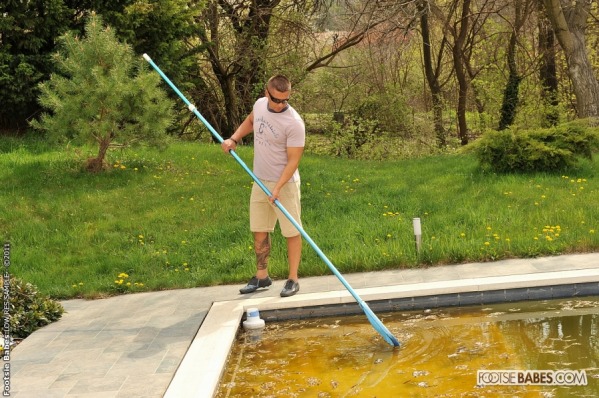 Zack cleaning the pool